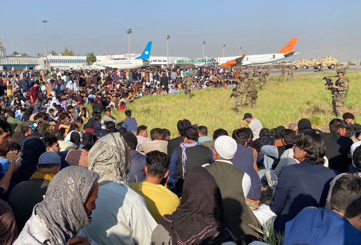 Chaos at Kabul airport continues as crowds try to flee Afghanistan