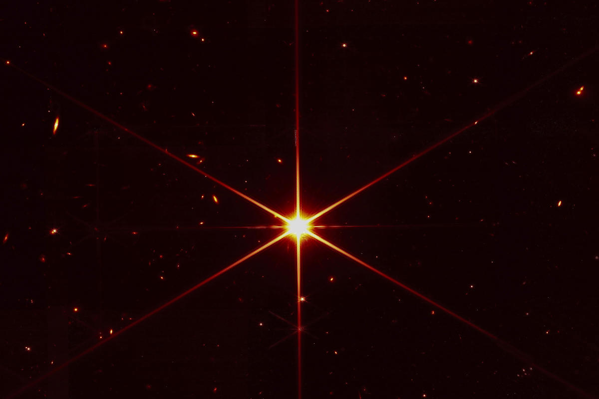 Space telescope's image of star gets photobombed by galaxies