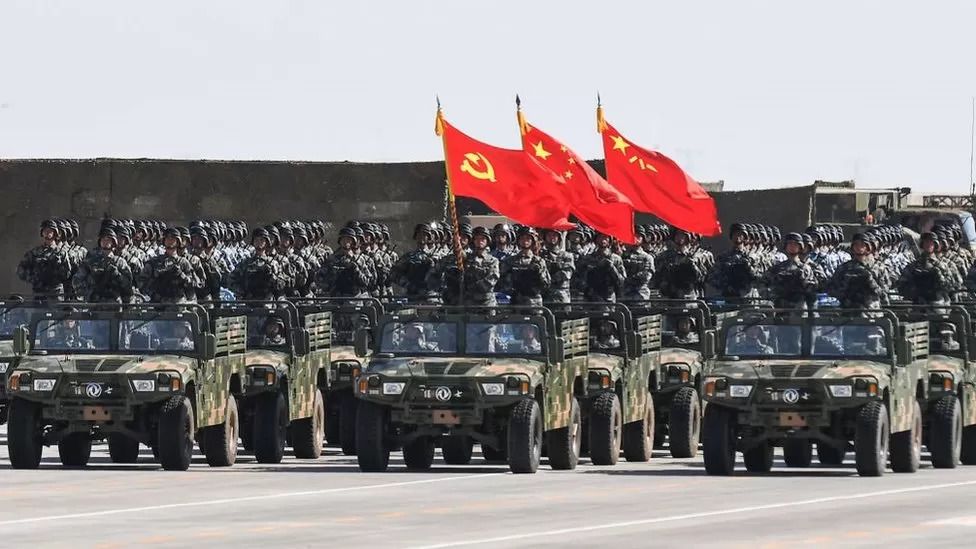 China boosts military budget while warning of escalating threats